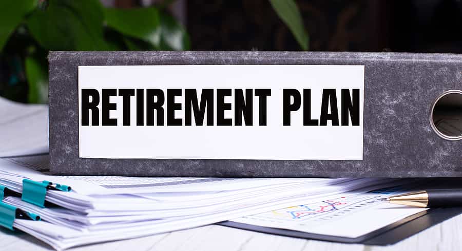 The Words Retirement Plan Is Written On A Gray File Folder Next